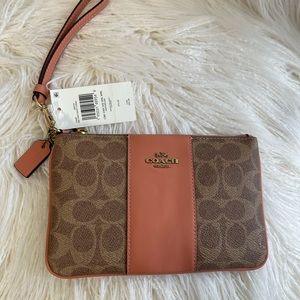 Coach Signature Tan and Coral Leather Wristlet.